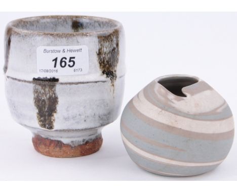 An ash glazed tea bowl by Jim Malone,
height 4" and a small signed vase in coloured clays, (2).