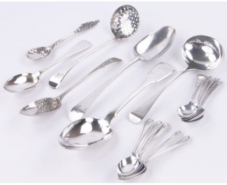 A group of silver flatware,
including George III sifter spoon, sauce ladle, etc.