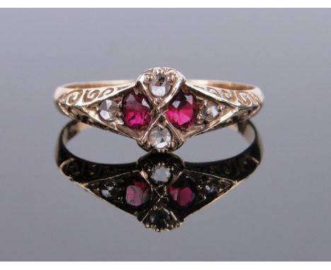 An 18ct gold ruby and diamond cluster ring,
size L.