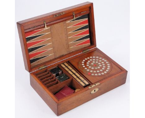 A Victorian mahogany cased games compendium,
including cribbage board, dominoes, lead horses, etc., box length 13".