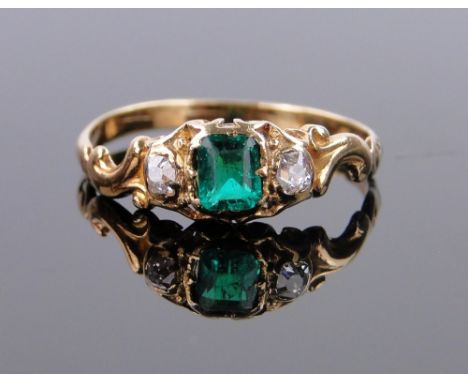 A 3 stone emerald and diamond set ring,
unmarked gold settings, size K.