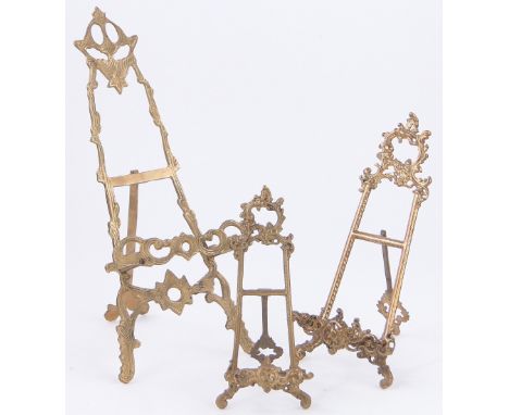 A cast brass table easel,
height 15.8", and 2 smaller cast brass easels, (3).