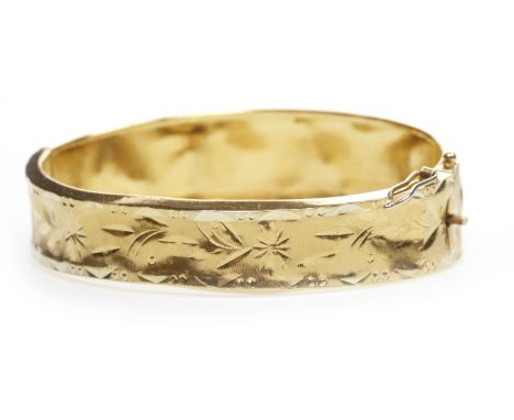 ORNATE BANGLE, with overlaid floral motif decoration, 55mm inner diameter, with foreign marks, 28.7g