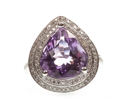 AMETHYST AND DIAMOND RING, the pear cut amethyst within a double diamond halo, the round brilliant cut diamonds totalling app