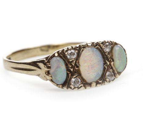 OPAL RING, the oval opal sections interspaced by pairs of round white gems, in nine carat gold, size P, 2.4g