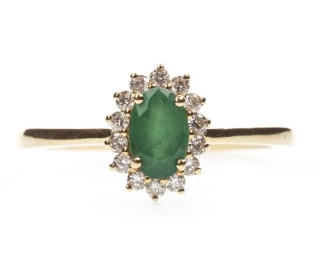 EMERALD AND DIAMOND RING, the oval emerald within a round brilliant cut diamond halo, the diamonds totalling approximately 0.