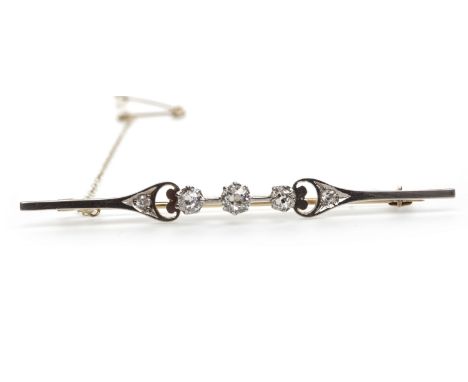DIAMOND BAR BROOCH, early to mid-twentieth century, set with graduated old cushion cut diamonds, the diamonds totalling very 
