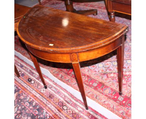 An early 19th century mahogany, satinwood, box and ebony line inlaid fold-over top card table, on turned supports, 40" wide