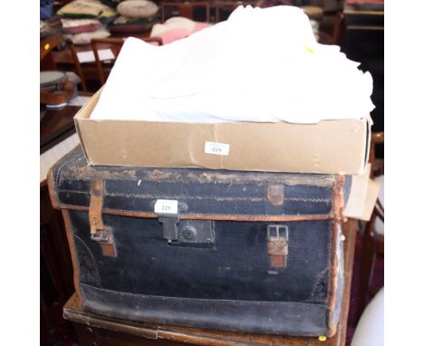 A collection of linen, infant's clothing and other textiles, in a 19th century canvas and leather case