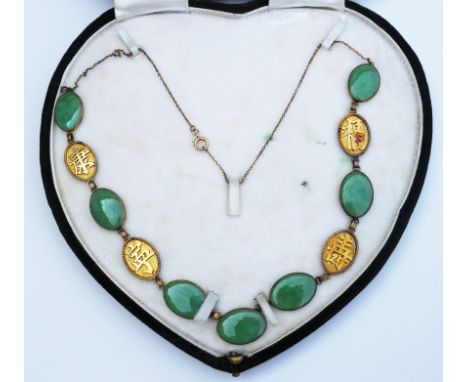 A Chinese yellow metal and jade necklace