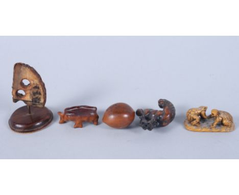 A scrimshaw panel sailing boat, on fossil tusk, 2" high, a Chinese carved seed with poem and figures, and an ivory netsuke of