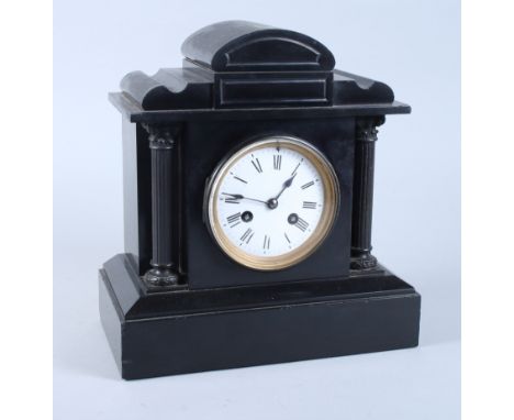 A 19th century slate mantel clock with white enamel dial and eight-day striking movement, 11" high