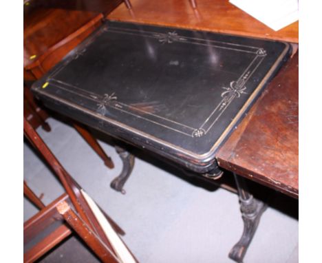 A late 19th century ebonised and gilt line inlaid fold-over top card table, on twin turned column and stretchered supports, 3