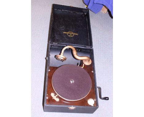 A Columbia portable record player and a collection of 78 rpm records, in carry case