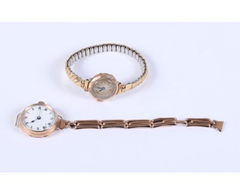 A lady's 9ct gold cased wrist watch, the white enamel dial with painted Roman numerals, and one other 9ct gold cased wristwat