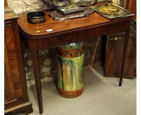 A George III mahogany fold-over card table, on square tapered supports, 35" wide (in need of restoration)