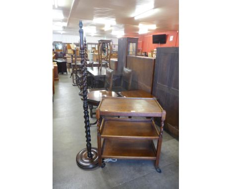 An oak barleytwist standard lamp and a trolley 