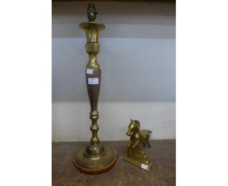 A brass table lamp and a jumping horse figure 