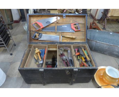 A large painted pine tool box with carpenter's tools 