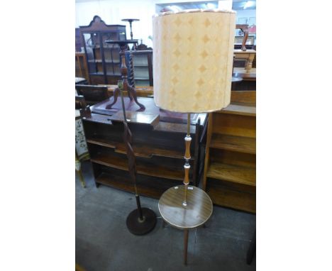 A teak standard lamp and another 
