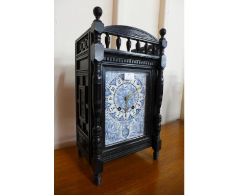 A Victorian Aesthetic Movement ebonised bracket clock, with blue and white porcelain dial, 48cms h 