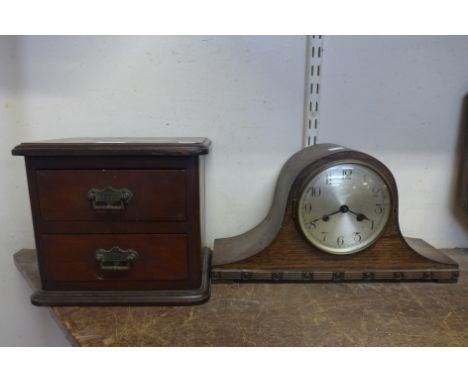 A small table top chest and an oak mantel clock 