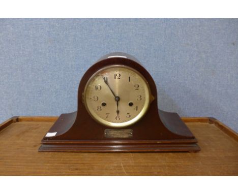 A mahogany mantel clock 