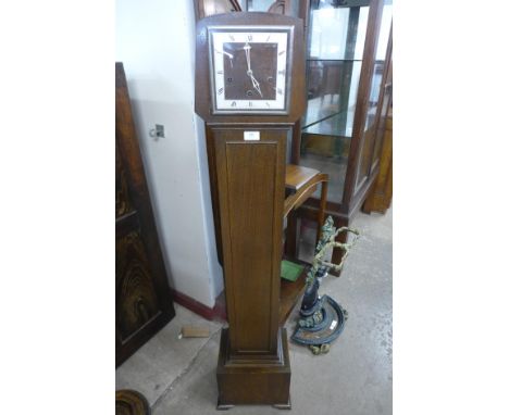 An Art Deco Smith Enfield oak dwarf longcase clock 