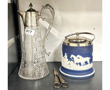 A silver plate and cut glass claret jug with an Adam's silver plated biscuit barrel and a pair of grape scissors.