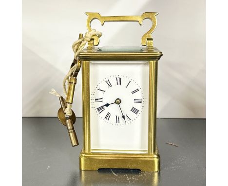 A gilt brass carriage clock, H. 15cm, appears to be in working order.