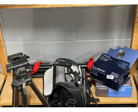 A Polaroid digital camcorder with a Lumix DMC digital camera, two tripods and case.
