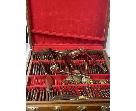 A cased bronze cutlery set, case size 43 x 45cm.