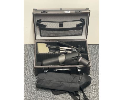 A cased Centon telescope and tripod.