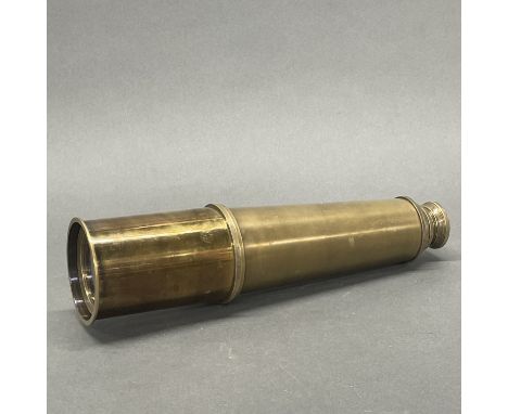 A brass telescope, closed L. 27cm.