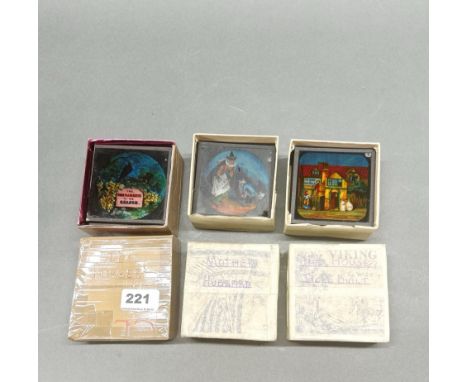 Three boxes of hand coloured Victorian glass lantern slides for Ali Baba, Mother Hubbard, and The House That Jack Built.