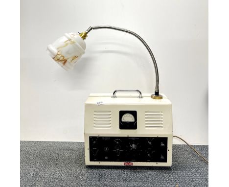 A vintage radio mounted as a desk lamp, W. 38cm.