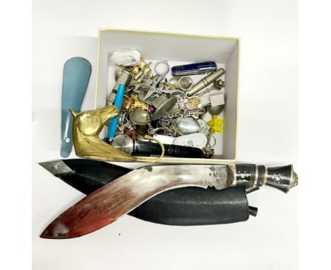 A box of mixed small items with a gurkha knife.
