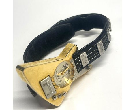 A vintage Gibson guitar wristwatch.