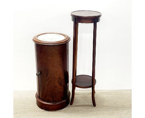 A cylindrical figured mahogany pedestal cupboard with marble top together with a two tier inlaid mahogany plant stand, H. 98c