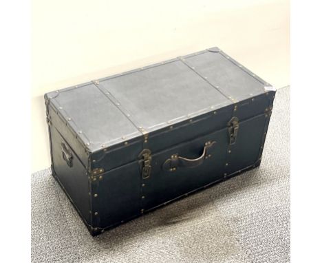 A faux leather covered trunk, size 71cm x 35cm x 35cm.