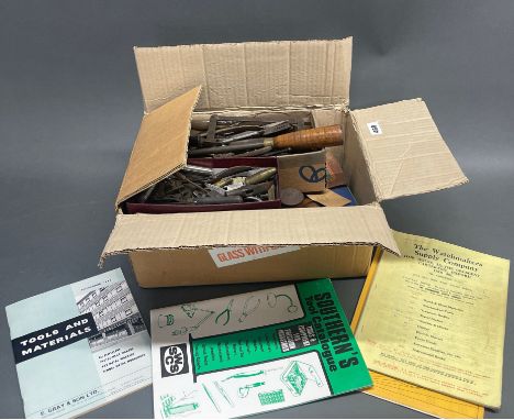 A large box of watch and clock making and repairing tools.