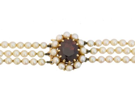 A 9ct gold garnet and cultured pearl necklace, A 9ct gold garnet and cultured pearl necklace, the triple strand of graduated 