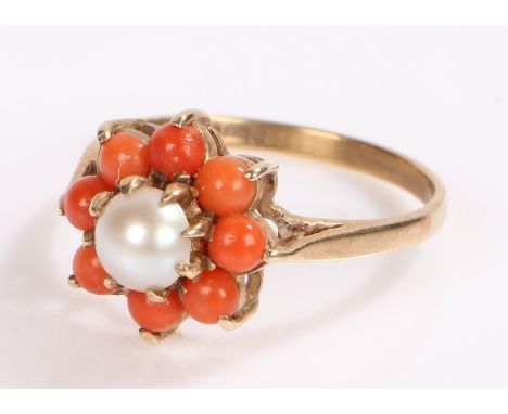 9 carat gold ring, with a pearl and coral effect surround