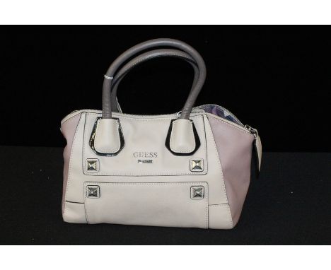 Guess handbag, in a light purple leather, complete with dust bag
