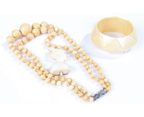 1920's jewellery, to include an ivory bangle and an ivory necklace