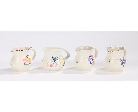 Four Poole pottery jugs, with foliate decoration (5)