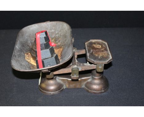 Avery Scales, together with stacks of weights 