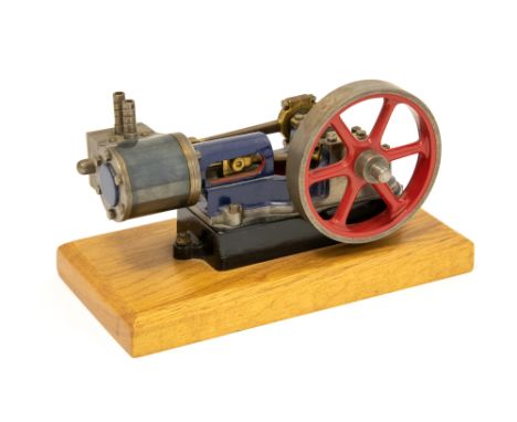 Stuart Turner: A mounted Stuart Turner model stationary engine, single flywheel, measuring 7.5cm approx, base measuring 18cm 