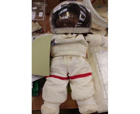Signed astronaut Alex Volkov, a black cabbage patch doll in astronaut clothing and helmet 