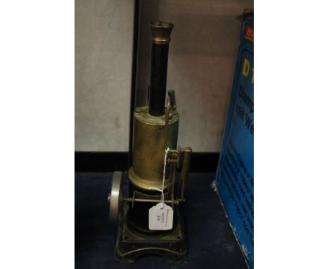 Bing: A Bing tinplate vertical steam engine, circa 1905, 32cm height approx, single flywheel.